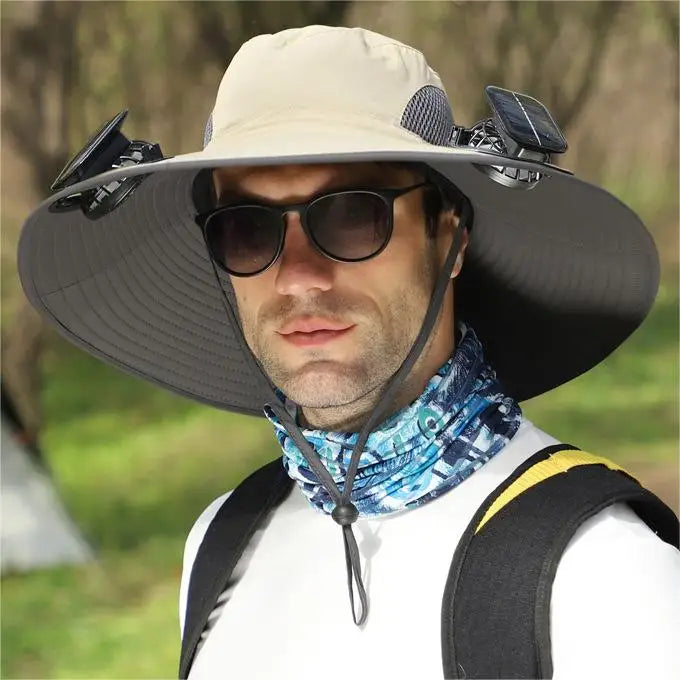 Person wearing a wide-brimmed hat with neck cover and sunglasses outdoors